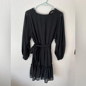 NWT Long sleeve black mini dress. Brand is Flying Tomato. Flowy